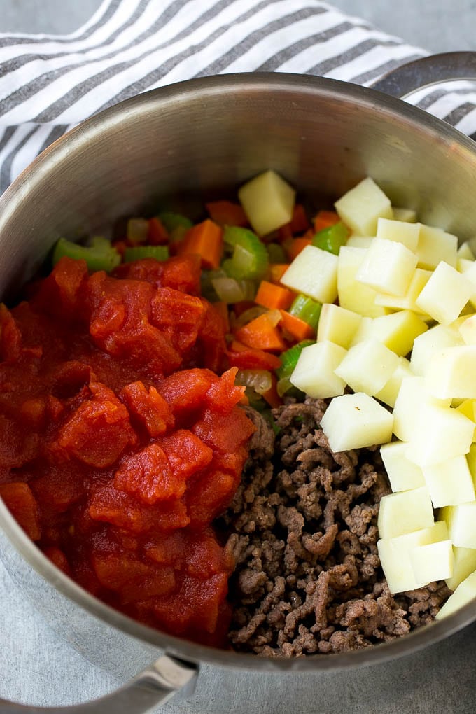 Hamburger Soup Recipe | Hamburger Stew | Ground Beef Soup #hamburger #soup #groundbeef #stew #dinner #jonep Potatoes and tomatoes go into hamburger soup before the pot comes to a simmer.