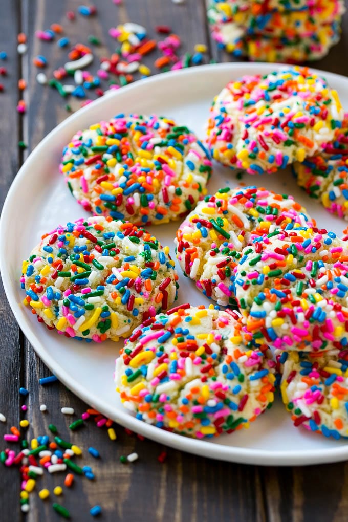 Funfetti Cookies Recipe | Funfetti Cake Mix Cookies | Sprinkle Cookies | Cake Mix Cookies #cookies #funfetti #sprinkles #dessert #jonep A plate of funfetti cookies coverd in rainbow sprinkles.