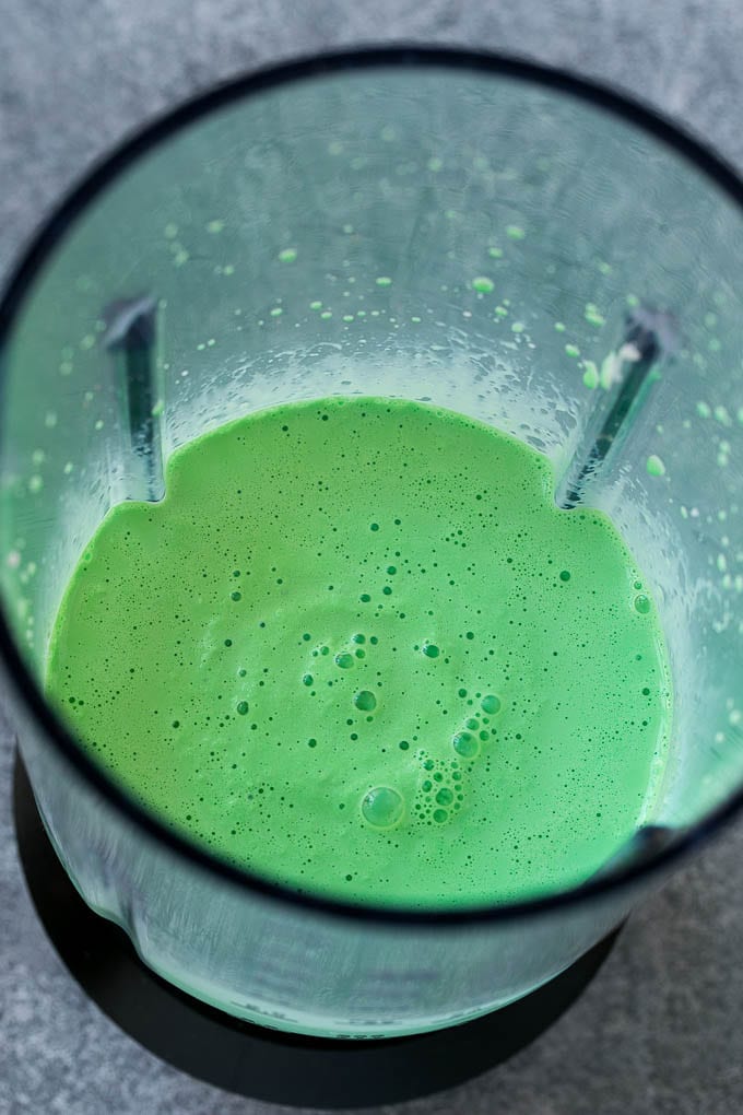 Shamrock Shake Recipe | McDonald's Shamrock Shake | Saint Patrick's Day Drink | Mint Milkshake #milkshake #stpatricksday #saintpatricksday #mint #jonep Green milkshake in a blender.
