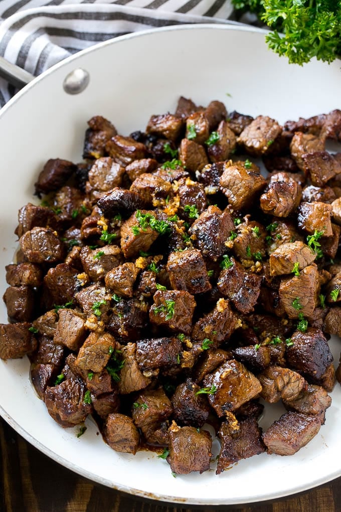 Steak Bites in Garlic Butter Recipe | Garlic Steak | Sirloin Steak Recipe | Steak Appetizer #steak #lowcarb #keto #jonep #dinner A frying pan of beef cubes tossed in garlic butter.