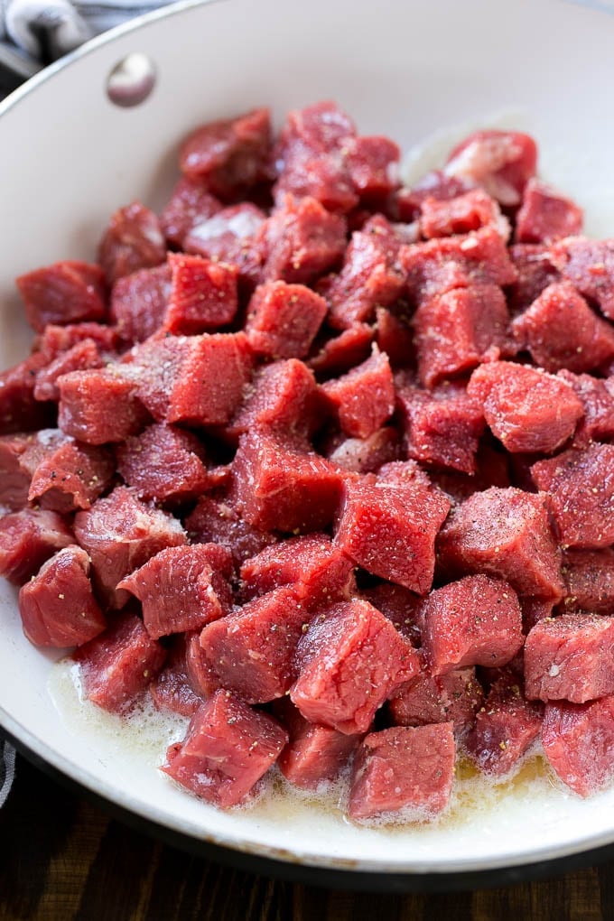 Steak Bites in Garlic Butter Recipe | Garlic Steak | Sirloin Steak Recipe | Steak Appetizer #steak #lowcarb #keto #jonep #dinner Cubes of raw beef seasoned with salt and black pepper.