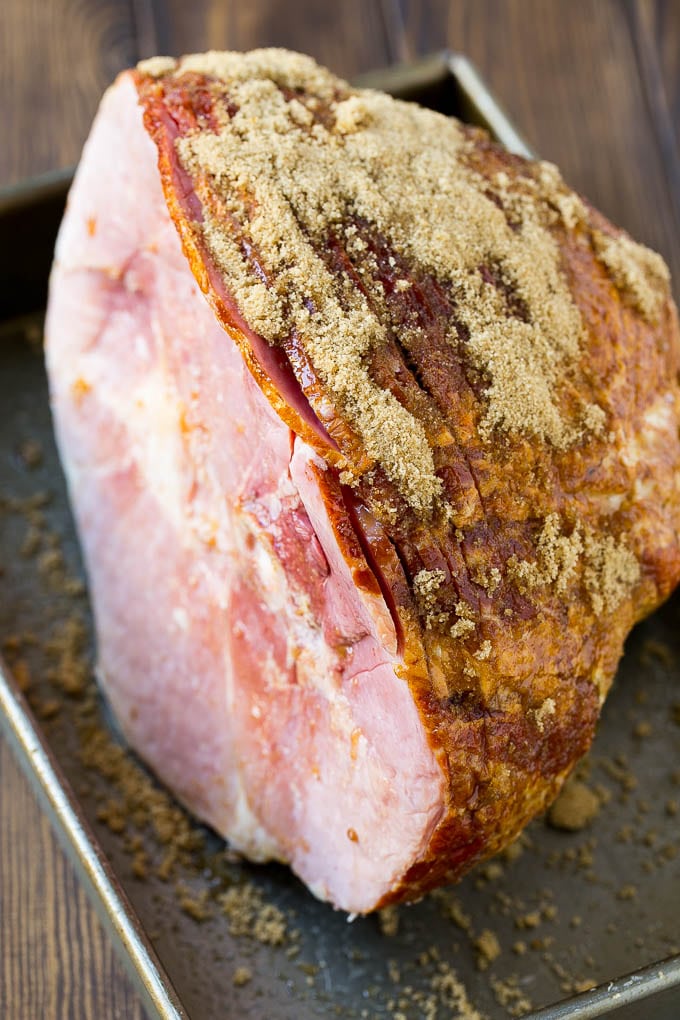Coca Cola Ham | Coke Glazed Ham | Easter Ham | Christmas Ham | Holiday Ham Recipe #ham #easter #christmas #dinner #jonep A spiral glazed ham coated in brown sugar.