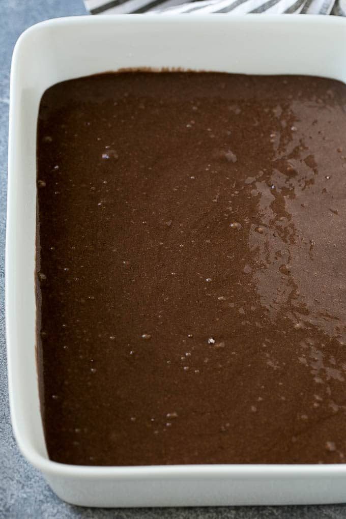 Earthquake Cake Recipe | Chocolate Cake Recipe | Chocolate Coconut Cake | Coconut Pecan Cake #cake #chocolate #coconut #pecans #dessert #chocolatecake #jonep Chocolate cake batter in a baking dish.