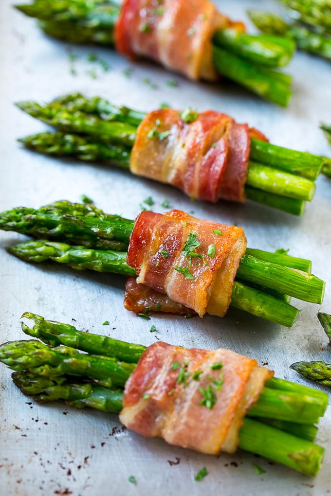 Bacon Wrapped Asparagus Recipe | Roasted Asparagus | Asparagus Side Dish #asparagus #bacon #sidedish #dinner #jonep Roasted asparagus in bundles on a sheet pan.