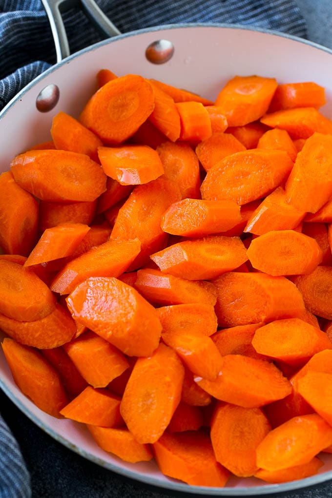 Candied Carrots Recipe | Carrot Side Dish | Brown Sugar Carrots | Glazed Carrots #carrots #brownsugar #sidedish #dinner #jonep Raw sliced carrots in a pan.