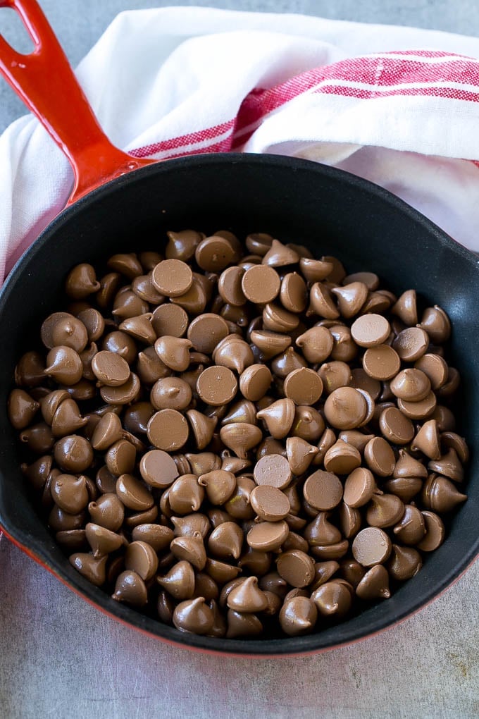 S'mores Dip Recipe | S'mores Skillet | Baked S'mores #smores #dip #chocolate #marshmallow #dessert #jonep A skillet of milk chocolate chips.