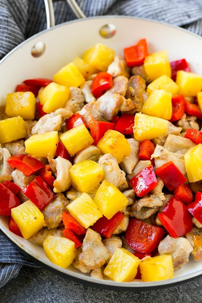 Pineapple Chicken | Hawaiian Chicken | Chicken Stir Fry #pineapple #chicken #dinner #stirfry #jonep A skillet of cooked chicken, pineapple and red bell peppers.