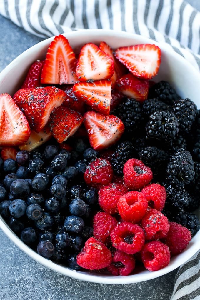 Berry Fruit Salad Recipe | Berry Salad | Summer Berry Salad | Fruit Salad Recipe #berries #fruitsalad #jonep A bowl of blueberries, raspberries, blackberries and strawberries topped with poppy seed dressing.