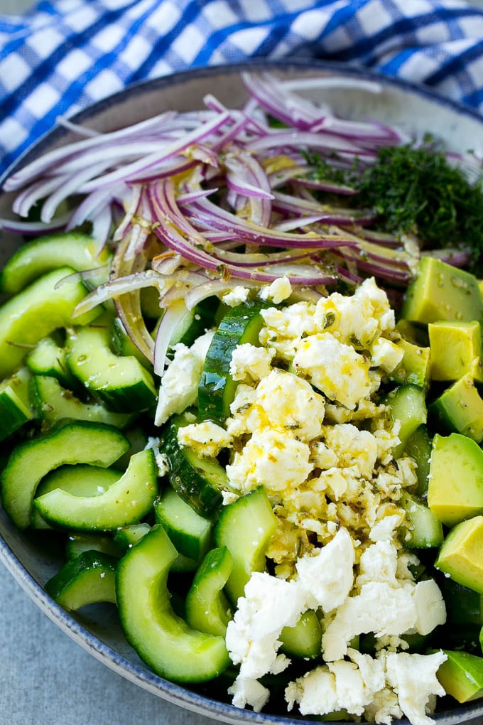 Cucumber Feta Salad Recipe | Cucumber Salad | Feta Cheese Salad | Summer Salad #salad #cucumber #jonep Veggies and cheese topped with Greek dressing.