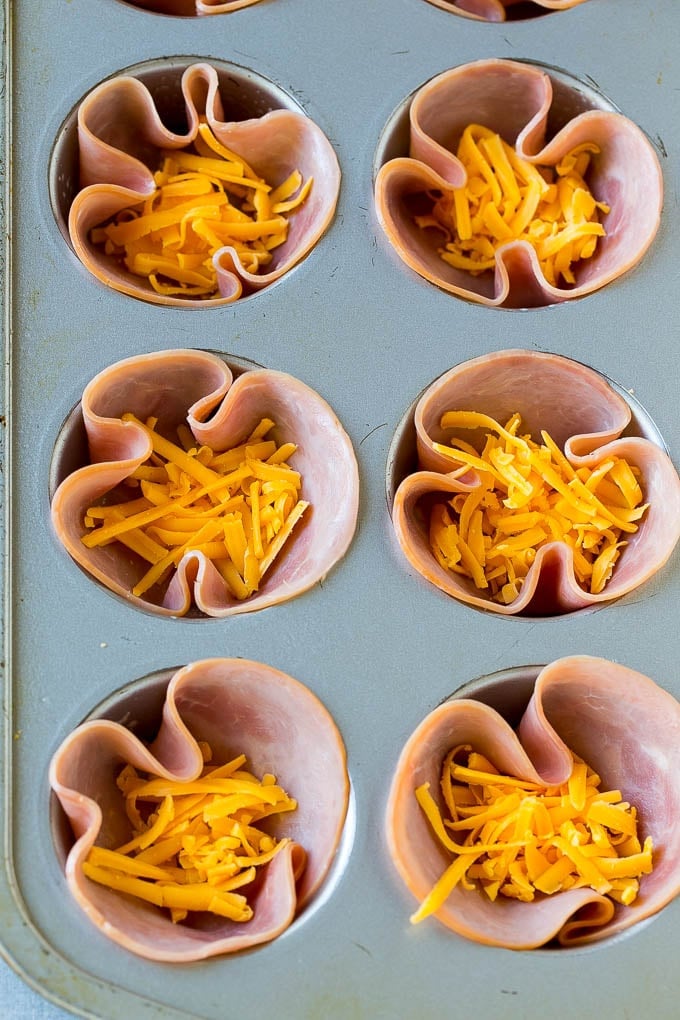 Ham and Egg Cups Recipe | Low Carb Breakfast | Ham and Eggs #ham #eggs #lowcarb #breakfast #jonep Ham pressed into muffin tins and topped with shredded cheese.