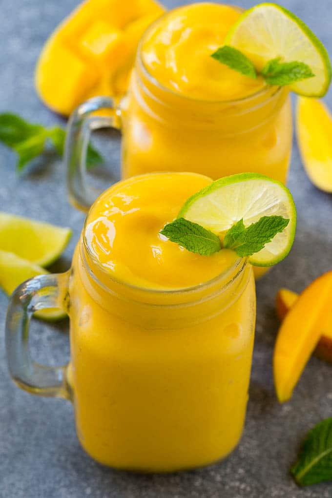Mango Smoothie Recipe | Mango Recipe | Healthy Smoothie #mango #smoothie #drink #jonep Mango smoothie in a mason jar mug.