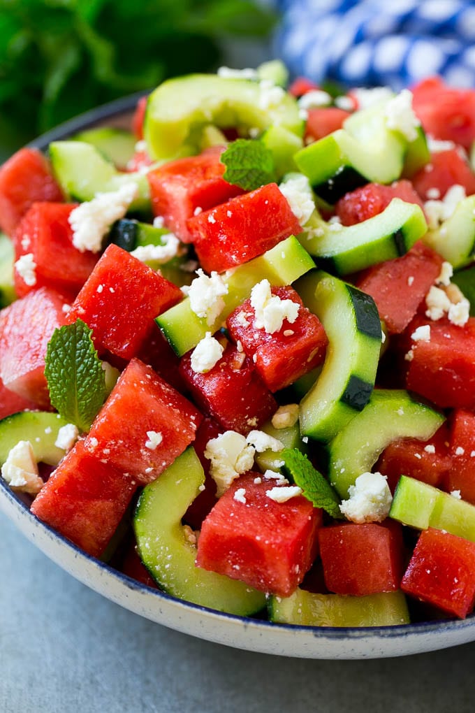 Watermelon Salad Recipe | Watermelon Feta Salad | Watermelon Cucumber Salad #watermelon #cucumber #salad #jonep Watermelon salad with cucumbers, feta cheese and mint in a serving bowl.