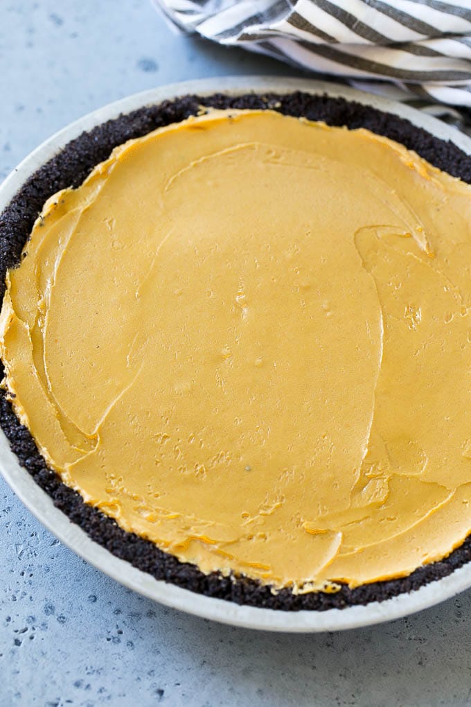 Chocolate Peanut Butter Pie Recipe | Peanut Butter Cup Pie | Peanut Butter Pie | No Bake Pie #chocolate #peanutbutter #pie #nobake #dessert #jonep Peanut butter filling inside a chocolate cookie crust.