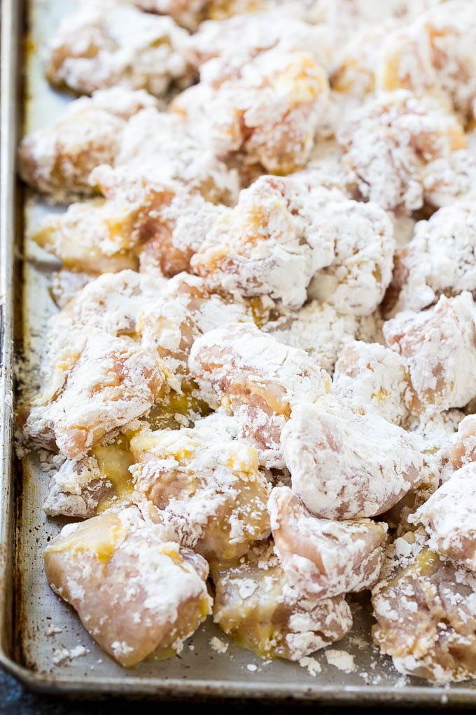Orange Chicken Recipe | Chinese Orange Chicken | Panda Express Orange Chicken #orange #chicken #takeout #chinesefood #dinner #jonep Chicken pieces coated in egg and flour.