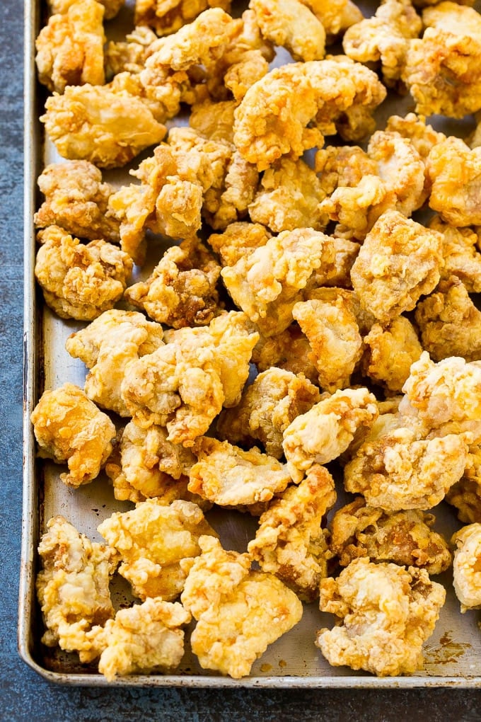 Orange Chicken Recipe | Chinese Orange Chicken | Panda Express Orange Chicken #orange #chicken #takeout #chinesefood #dinner #jonep Crispy fried chicken on a sheet pan.