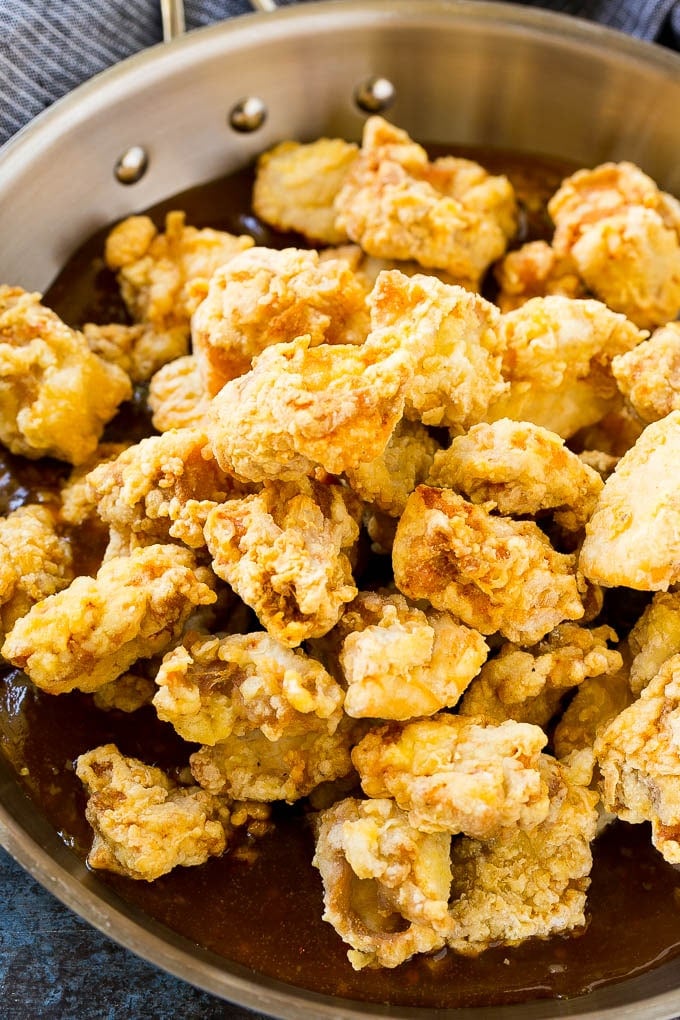 Orange Chicken Recipe | Chinese Orange Chicken | Panda Express Orange Chicken #orange #chicken #takeout #chinesefood #dinner #jonep Crispy chicken pieces in a pan of orange sauce.