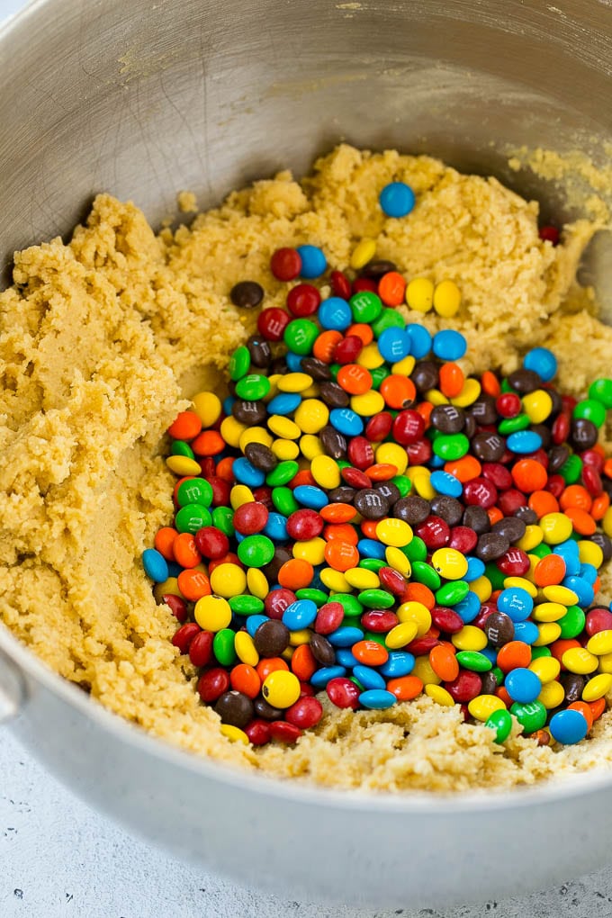Oreo Stuffed Cookies Recipe | M&M's cookies | Stuffed Cookies #cookies #chocolate #oreos #dessert #baking #jonep Cookie dough in a mixing bowl with miniature M&M's in it.