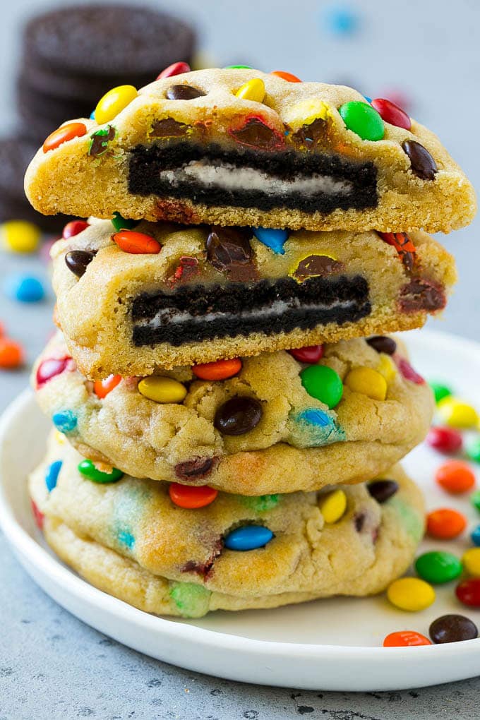Oreo Stuffed Cookies Recipe | M&M's cookies | Stuffed Cookies #cookies #chocolate #oreos #dessert #baking #jonep A stack of Oreo stuffed cookies on a plate.