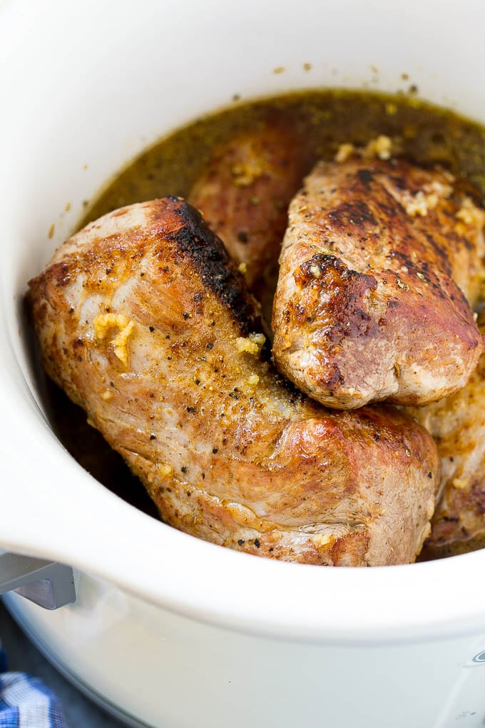 Slow Cooker Pork Tenderloin Recipe | Crock Pot Pork Tenderloin | Easy Pork Tenderloin #slowcooker #crockpot #pork #dinner #jonep Seared pork tenderloin in a slow cooker with seasonings.