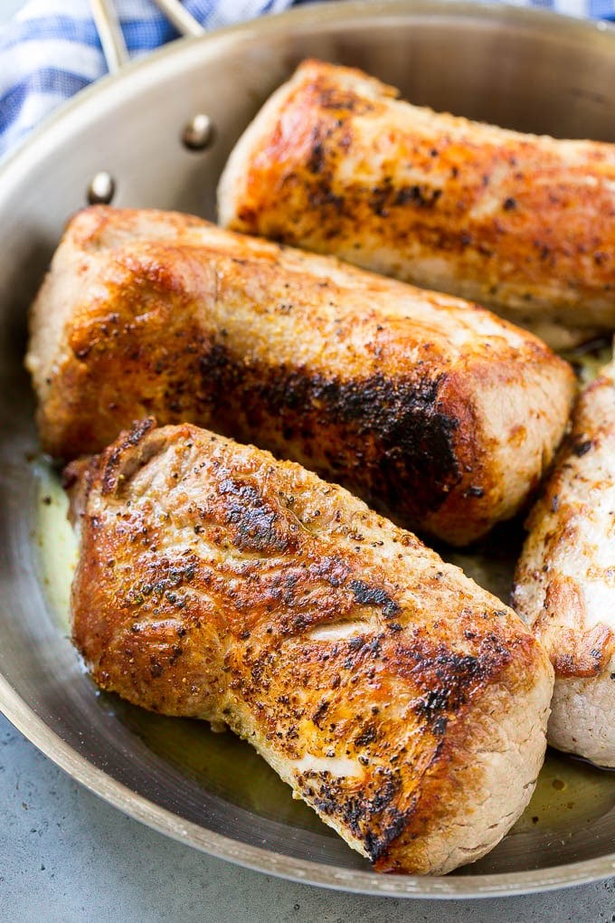 Slow Cooker Pork Tenderloin Recipe | Crock Pot Pork Tenderloin | Easy Pork Tenderloin #slowcooker #crockpot #pork #dinner #jonep Seared pork tenderloin in a skillet.
