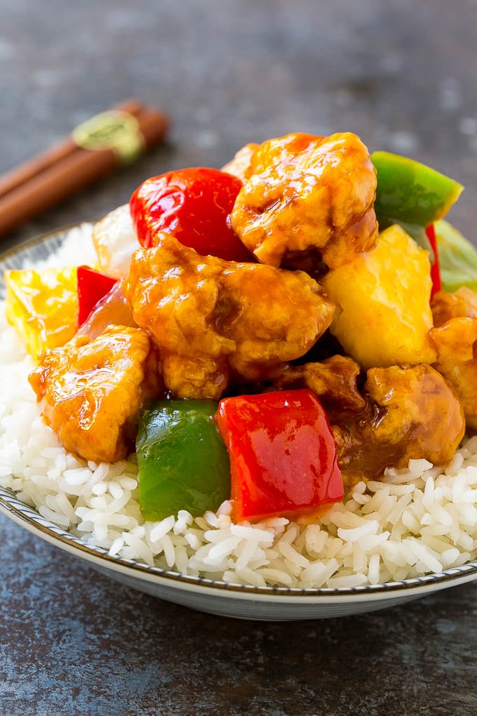 Sweet and Sour Chicken Recipe | Chinese Food Copycat Recipe | Chicken with Pineapple #chicken #chinesefood #pineapple #stirfry #takeout #dinner #jonep A bowl of sweet and sour chicken, served over steamed rice.