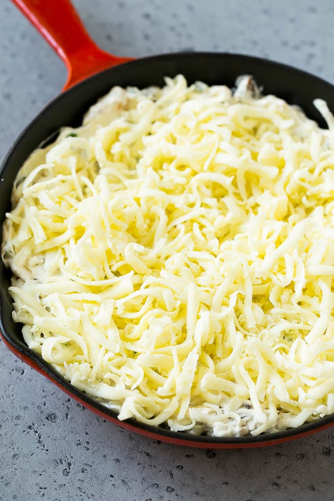 Philly Cheesesteak Dip Recipe | Cheesy Dip | Baked Cheese Dip #steak #dip #appetizer #cheese #jonep Philly cheesesteak dip with shredded cheese on top, waiting to go into the oven.