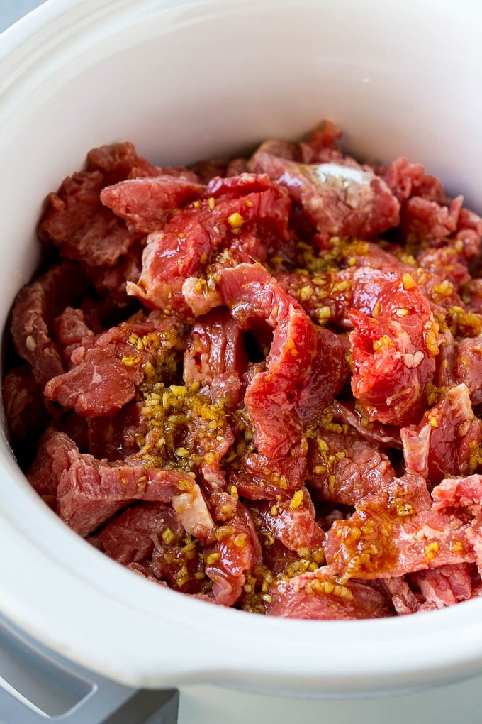 Slow Cooker Korean Beef Recipe | Korean Beef | Flank Steak Recipe #dinner #beef #slowcooker #crockpot #asian #jonep Flank steak strips in a soy, ginger and garlic sauce.