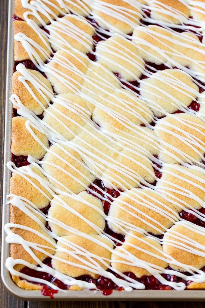 Cherry Bars Recipe | Cherry Pie Bars | Cherry Cookies | Bar Cookies #cookies #bars #cherry #baking #dessert #sweets #jonep Cherry bars topped with vanilla glaze.