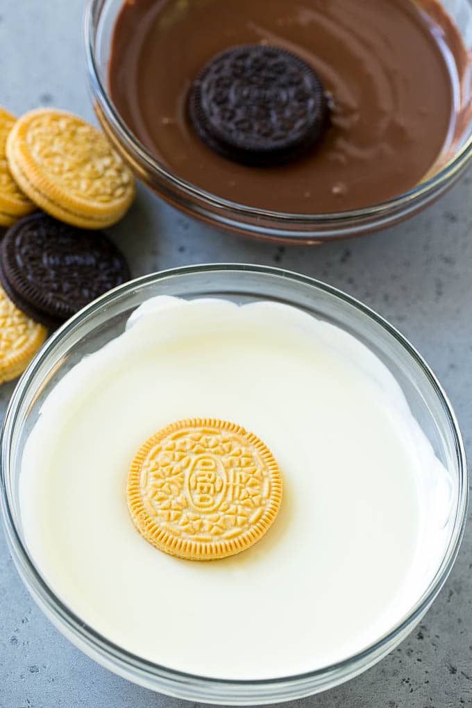 Chocolate Covered Oreos Recipe | Oreo Cookies | Chocolate Dipped Oreos #oreo #cookies #chocolate #sprinkles #dessert #jonep Cookies being dipped into dark and white chocolate.