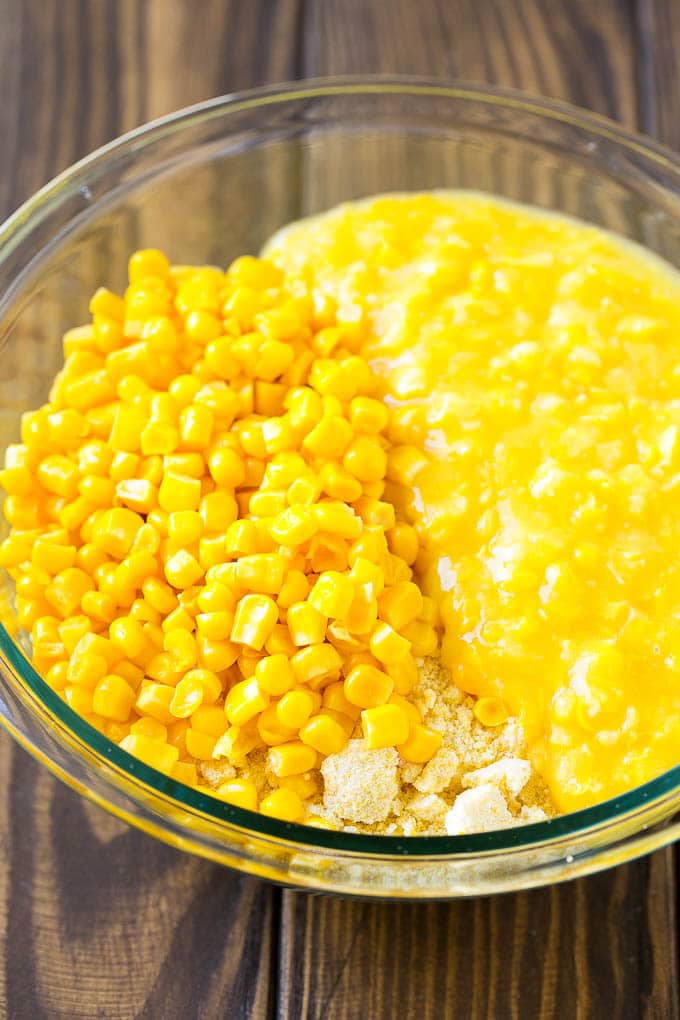 Corn Pudding Recipe | Corn Casserole | Corn Side Dish #corn #pudding #casserole #sidedish #thanksgiving #dinner #jonep Corn kernels, creamed corn and cornbread mix in a bowl.