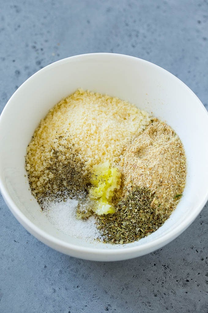 Italian Chicken Recipe | Sheet Pan Chicken | Baked Chicken #chicken #potatoes #dinner #jonep A mixture of breadcrumbs, parmesan cheese, garlic and herbs in a bowl.