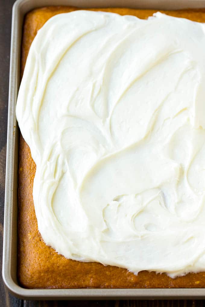 Pumpkin Bars Recipe | Pumpkin Cake | Pumpkin Dessert #pumpkin #fall #dessert #jonep #thanksgiving Cream cheese frosting spread over cake.