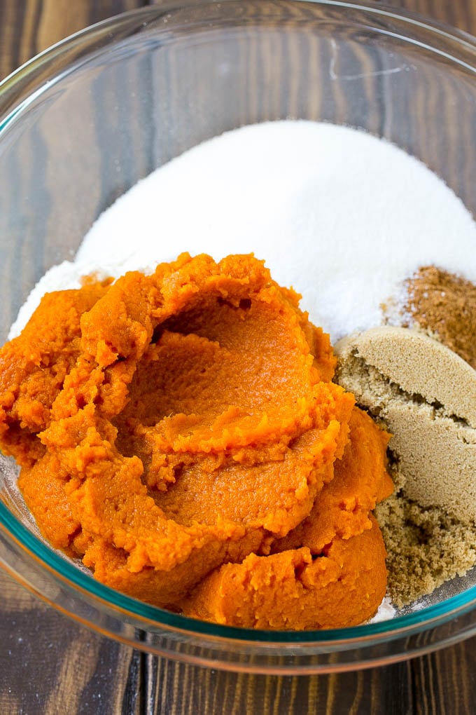 Pumpkin Bars Recipe | Pumpkin Cake | Pumpkin Dessert #pumpkin #fall #dessert #jonep #thanksgiving Pumpkin puree, brown sugar and flour in a bowl.