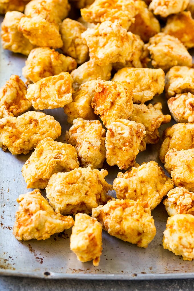 Sweet Chili Chicken Recipe | Thai Chicken | Asian Chicken #chicken #thaifood #chili #dinner #jonep Fried chicken breast pieces on a sheet pan.
