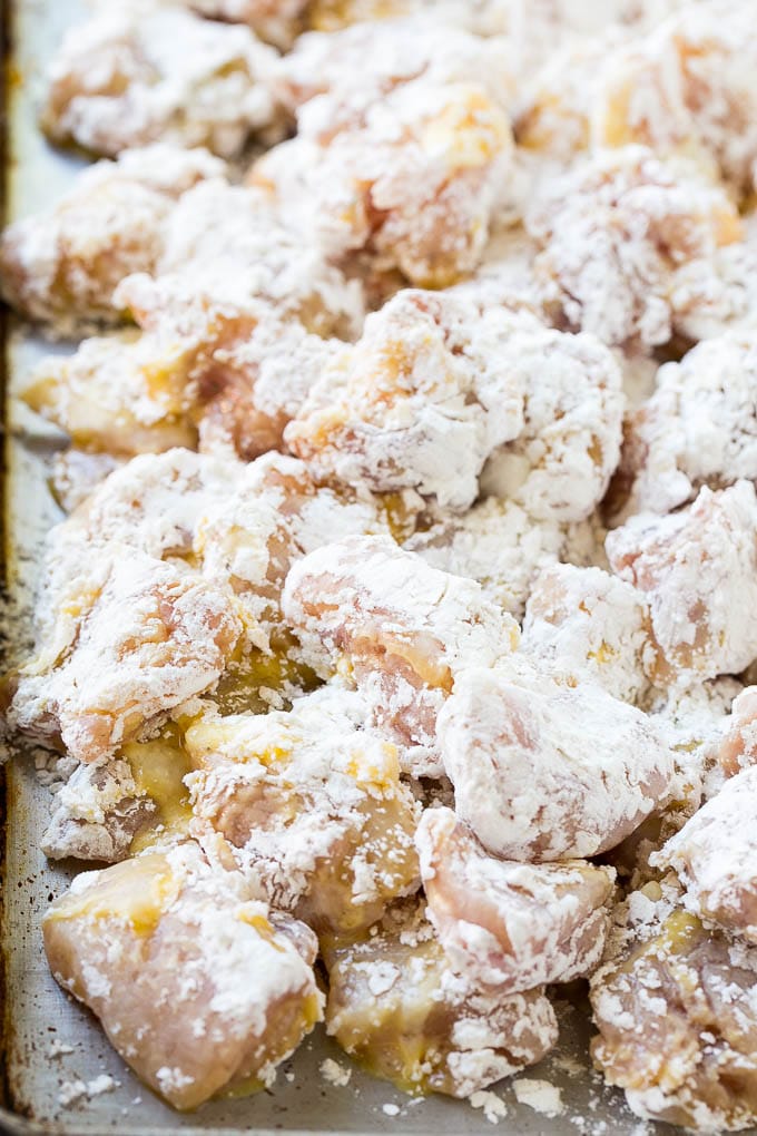 Sweet Chili Chicken Recipe | Thai Chicken | Asian Chicken #chicken #thaifood #chili #dinner #jonep Chicken pieces coated in egg and flour.
