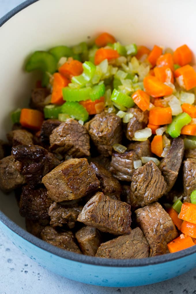 Stew meat, carrots, onions and celery in a large pot.