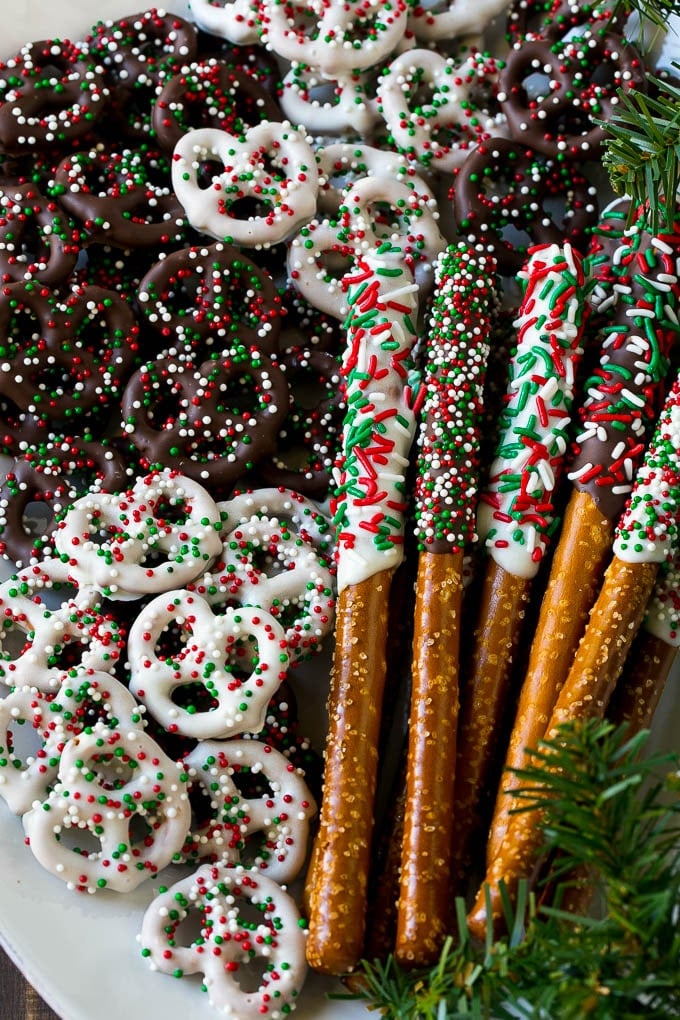Chocolate Covered Pretzels Recipe | Sprinkle Pretzels | No Bake Dessert #pretzels #chocolate #christmas #sprinkles #candy #jonep Chocolate covered pretzel twists and rods on a serving platter.