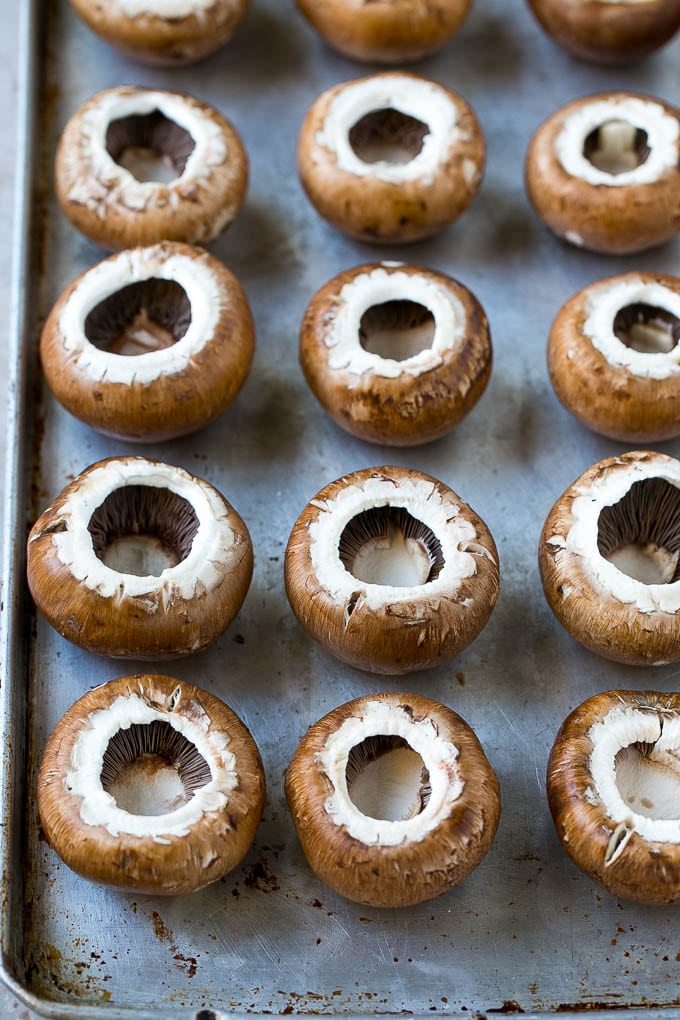 Crab Stuffed Mushrooms Recipe | Stuffed Mushrooms | Mushroom Appetizer #crab #seafood #mushrooms #lowcarb #appetizer #jonep Cremini mushroom caps on a sheet pan.