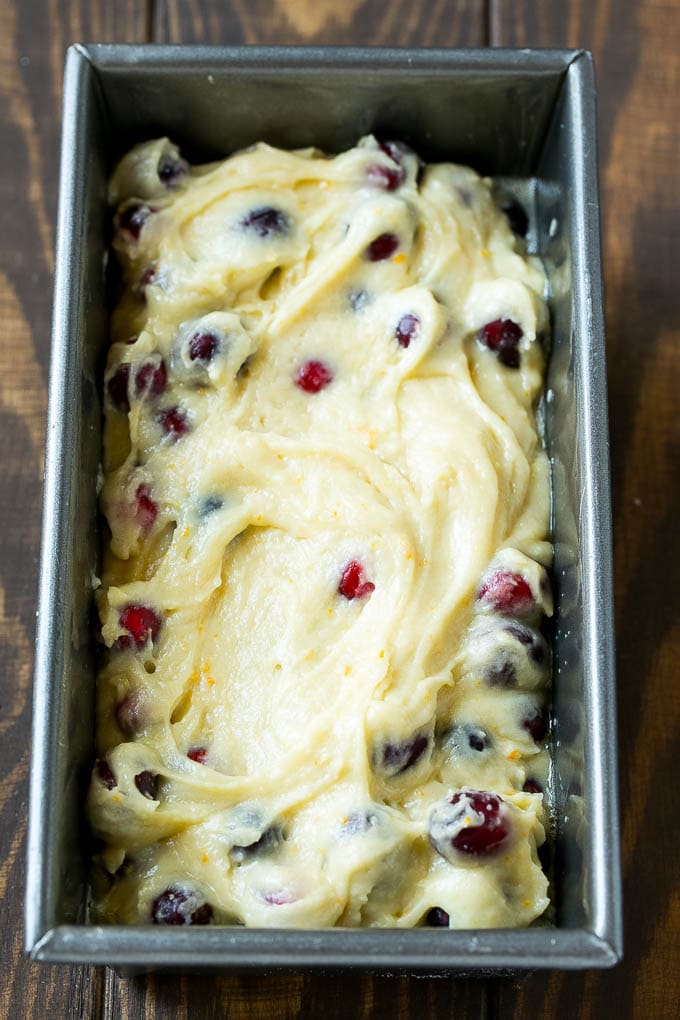 Cranberry Bread Recipe | Cranberry Loaf | Cranberry Orange Bread #cranberry #bread #baking #dessert #fall #jonep Ccranberry bread batter spread into a loaf pan.