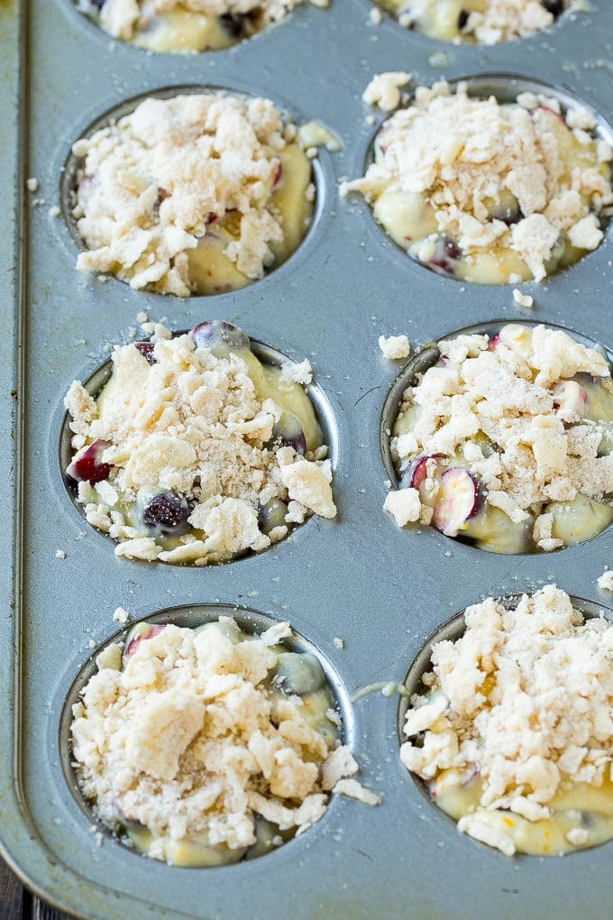 Cranberry Muffins Recipe | Cranberry Orange Muffins #cranberry #muffins #orange #fall #dessert #jonep Muffins topped with streusel ready to go into the oven.