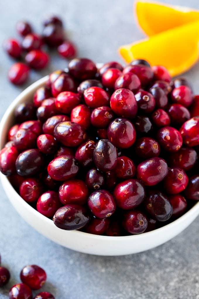 Cranberry Orange Sauce Recipe | Homemade Cranberry Sauce | Fresh Cranberry Sauce #cranberry #orange #fall #thanksgiving #sauce #dinner #jonep A bowl of fresh cranberries.
