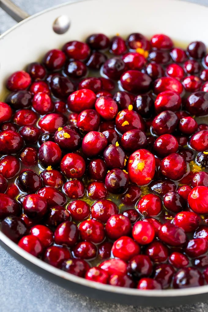 Cranberry Orange Sauce Recipe | Homemade Cranberry Sauce | Fresh Cranberry Sauce #cranberry #orange #fall #thanksgiving #sauce #dinner #jonep Berries in a skillet with orange juice, sugar and orange zest.