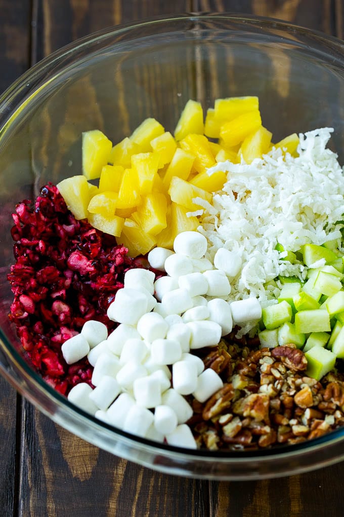 Cranberry Salad Recipe | Fluff Salad #cranberry #salad #fall #dinner #jonep #thanksgiving Chopped cranberries, apples, pineapple, marshmallows, pecans and coconut in a mixing bowl.