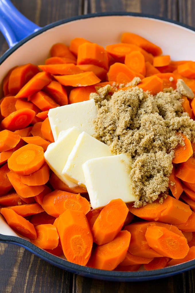 Glazed Carrots Recipe | Brown Sugar Carrots | Carrot Side Dish #carrots #brownsugar #sidedish #glutenfree #thanksgiving #fall #dinner #jonep Sliced cooked carrots with butter and brown sugar.