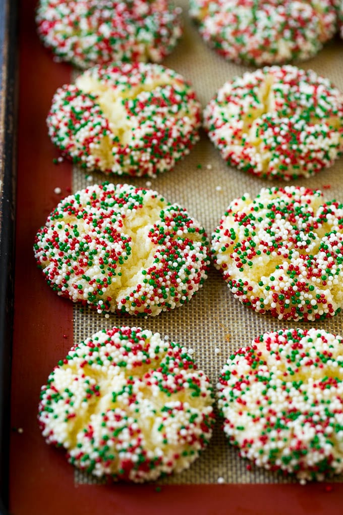 Gooey Butter Cookies Recipe | Cake Mix Cookies | Sprinkle Cookies | Christmas Cookies #cookies #butter #sprinkles #christmas #dessert #baking #jonep Baked gooey butter cookies on a sheet pan.