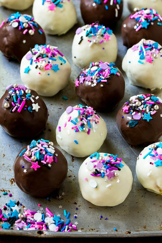 Oreo Balls Recipe | Oreo Truffles | Homemade Candy #truffles #candy #oreos #chocolate #sprinkles #dessert #christmas #jonep Assorted colors of Oreo balls on a sheet pan.