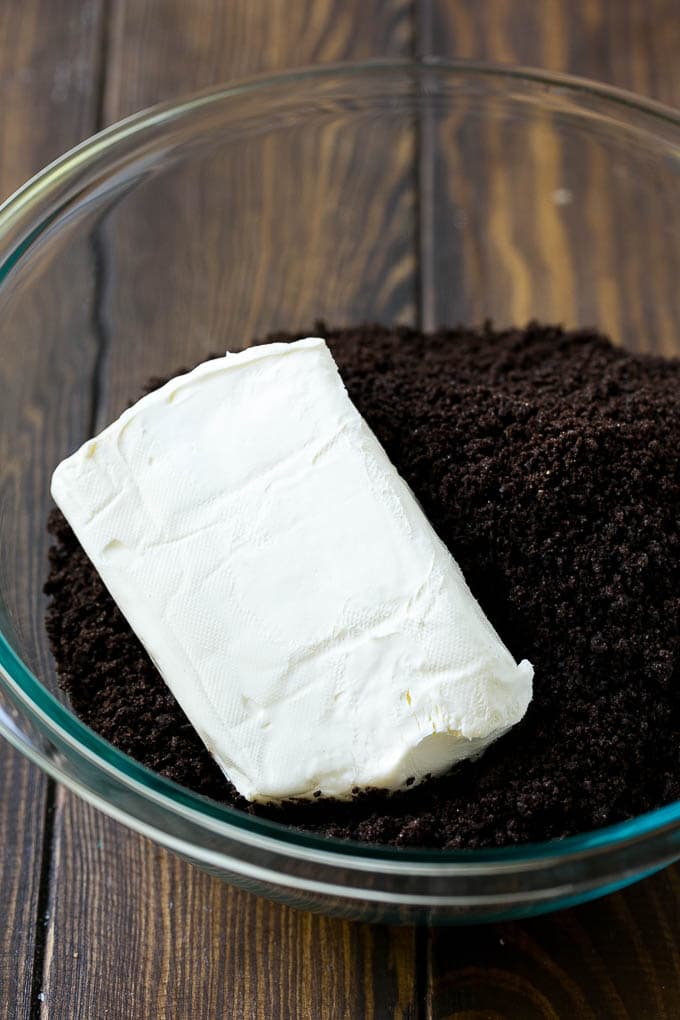 Oreo Balls Recipe | Oreo Truffles | Homemade Candy #truffles #candy #oreos #chocolate #sprinkles #dessert #christmas #jonep Cookie crumbs and cream cheese in a bowl.