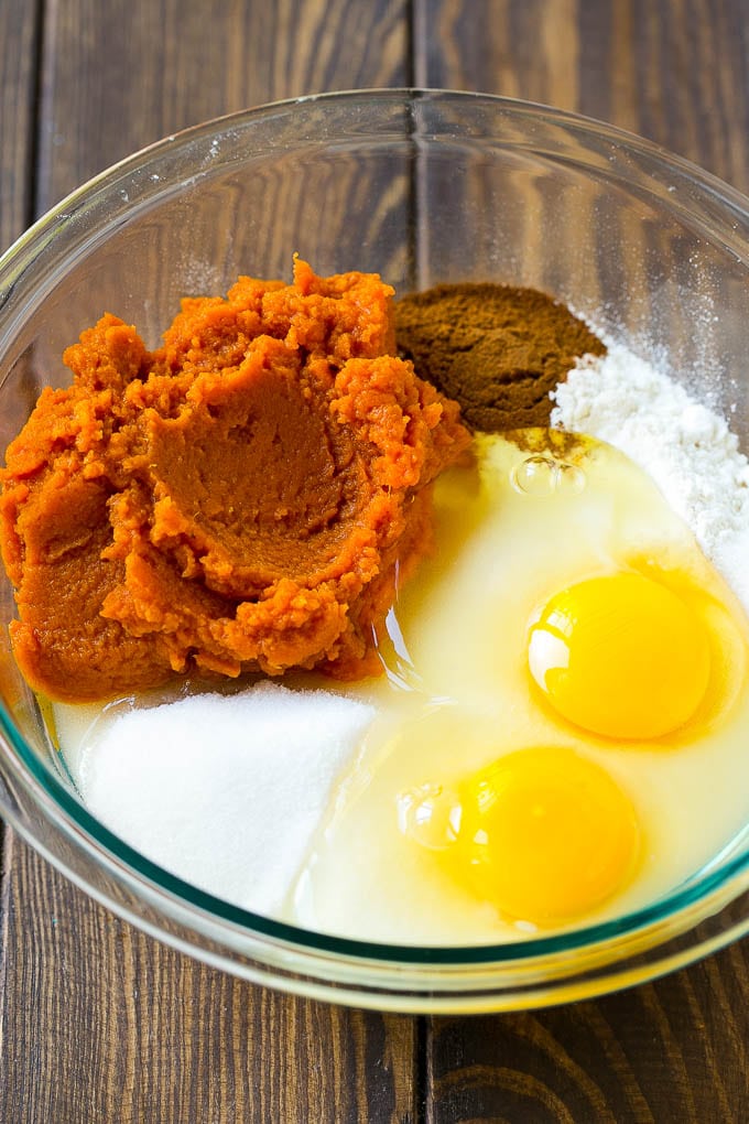 Pumpkin Chocolate Chip Bread Recipe | Pumpkin Bread | Chocolate Pumpkin Bread #pumpkin #bread #fall #chocolate #baking #dessert #jonep Sugar, eggs, pumpkin puree, flour and spices in a mixing bowl.