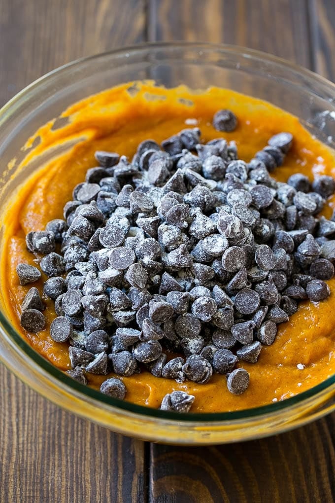 Pumpkin Chocolate Chip Bread Recipe | Pumpkin Bread | Chocolate Pumpkin Bread #pumpkin #bread #fall #chocolate #baking #dessert #jonep Pumpkin bread batter with chocolate chips in it.