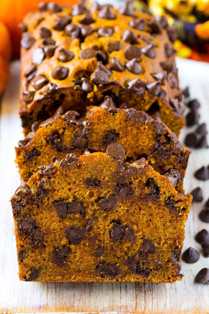 Pumpkin Chocolate Chip Bread Recipe | Pumpkin Bread | Chocolate Pumpkin Bread #pumpkin #bread #fall #chocolate #baking #dessert #jonep Sliced pumpkin chocolate chip bread on a serving board.